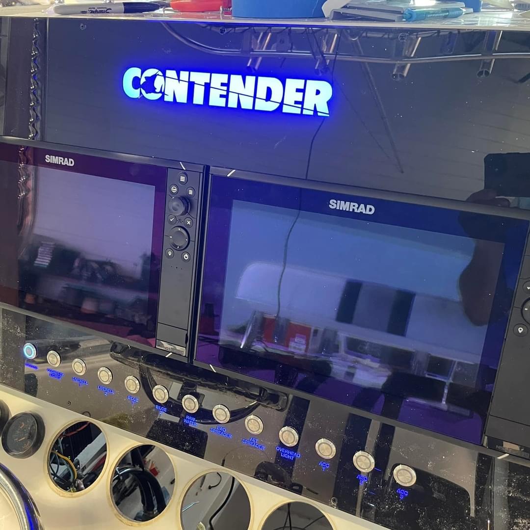 Custom acrylic boat dash panel with backlit switches